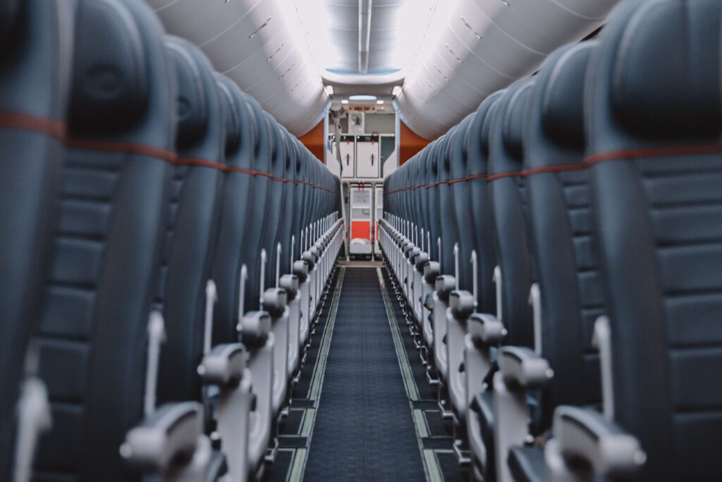 Rows of empty airplane seats representing airline seat inventory, capacity, airfare economics, and revenue management.