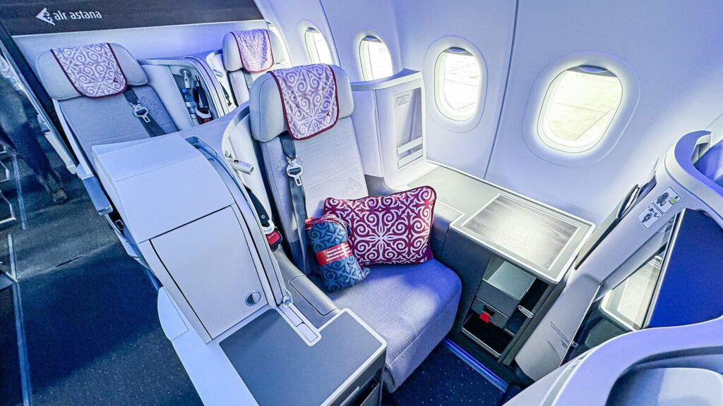 Air Astana Airbus A321neo business class seat illustrating the appeal of airline upgrades