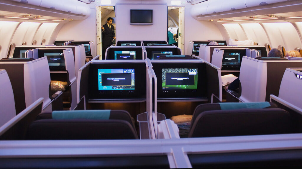 Oman Air business class cabin illustrating the value of redeeming airline miles for premium travel