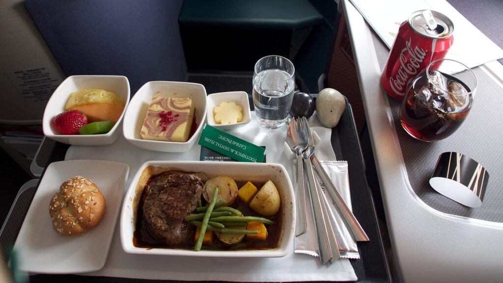 Cathay Pacific Business Class meal served at a premium cabin seat