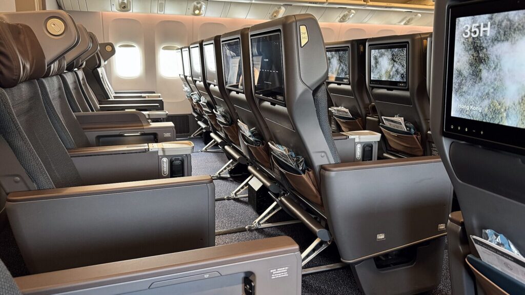 Cathay Pacific premium economy cabin with wider seats and additional legroom. Why Travelers Love Free Upgrades