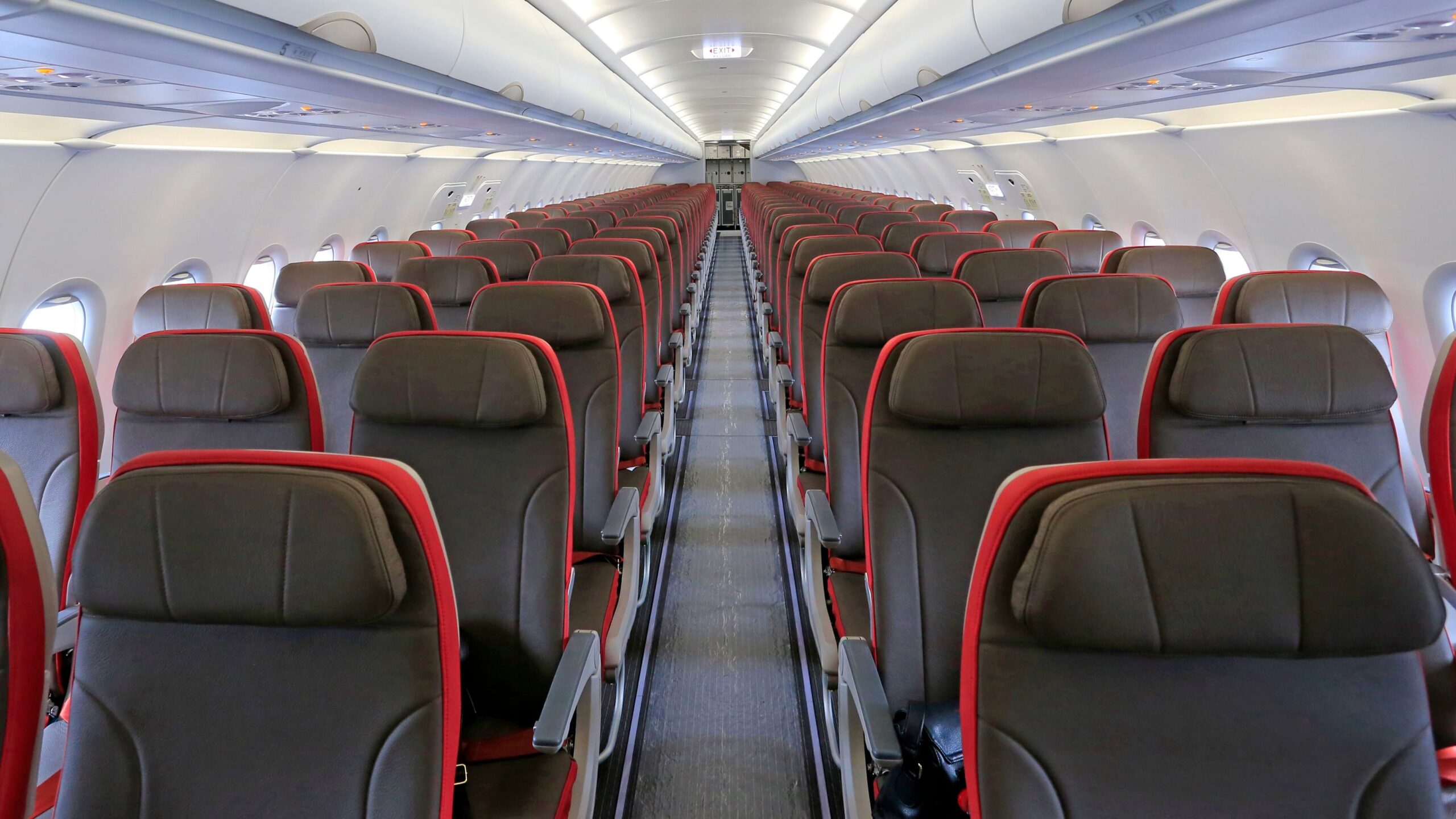 Empty airplane cabin illustrating how airlines manage seat inventory through revenue management rather than simply filling every seat.
