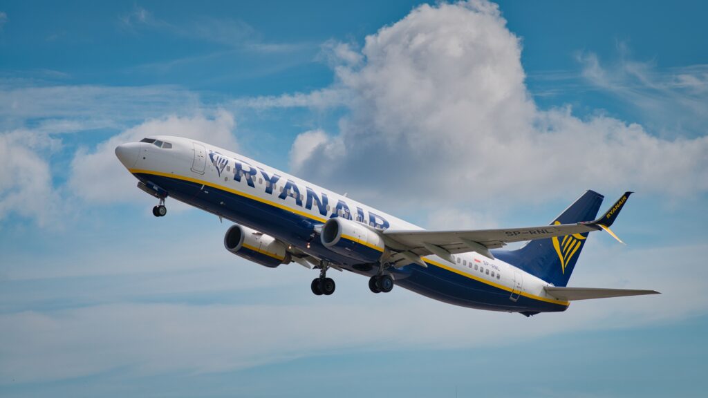 Ryanair aircraft taking off, illustrating when booking Basic Economy can be a smart choice for travelers on short flights with minimal baggage.